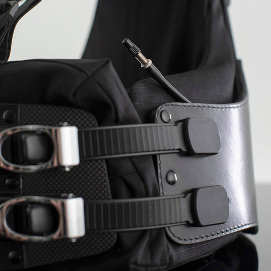 Air bladder tube peaking out from the side of a Flex Harness, showing the capped nozzle
