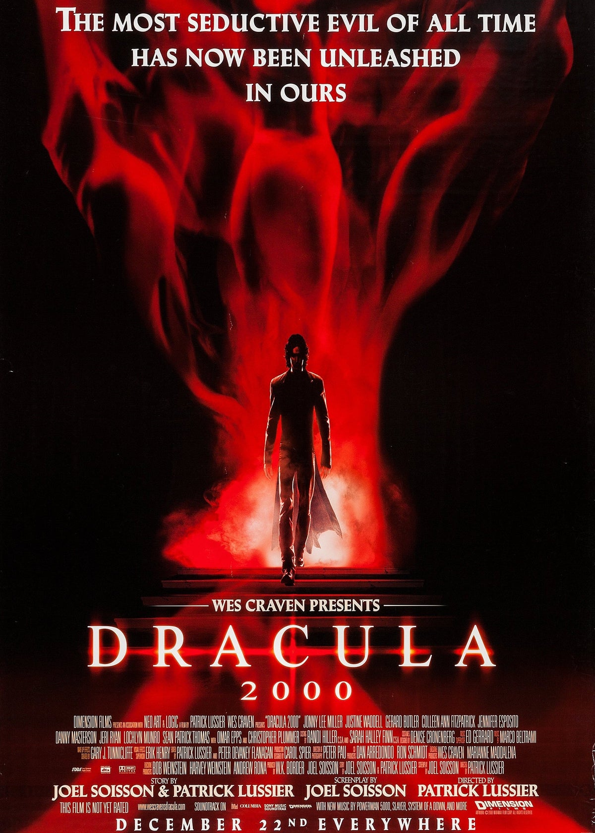 Movie poster for 'Dracula 2000' featuring Gerard Butler with a dark, shadowy figure standing in a glowing red and black mist. 