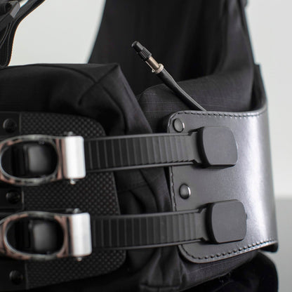 Air bladder tube peaking out from the side of a Flex Harness, showing the capped nozzle