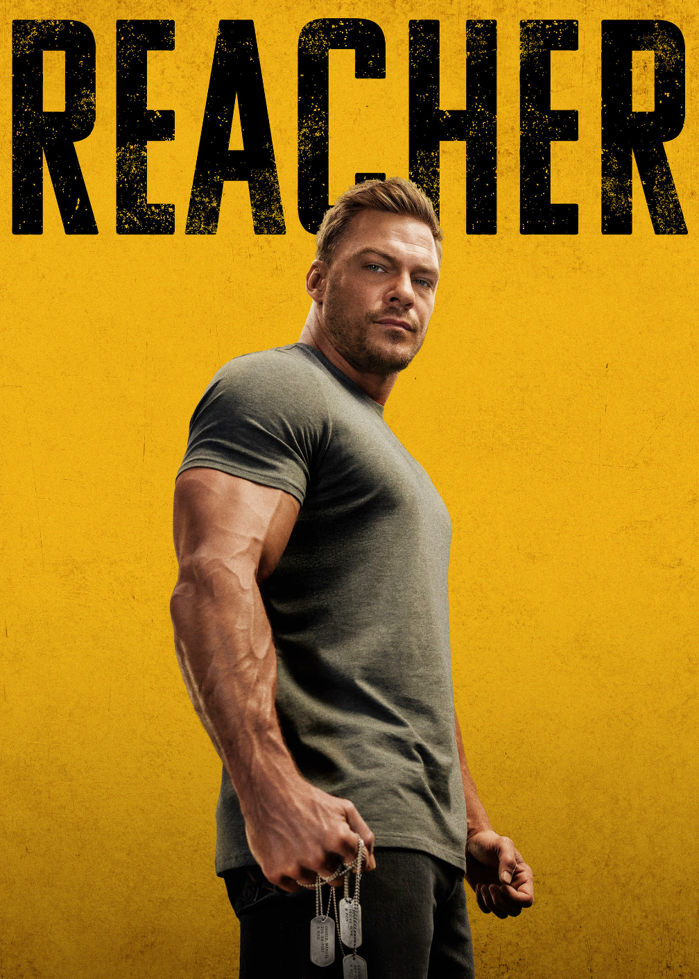 Promotional poster for the TV show 'Reacher' season 2, featuring a muscular man in a dark gray t-shirt holding dog tags against a textured yellow background.