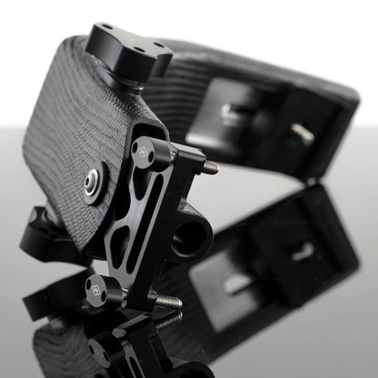 A black carbon arm for a camera stabilizer or similar equipment, showing a reflective metal surface