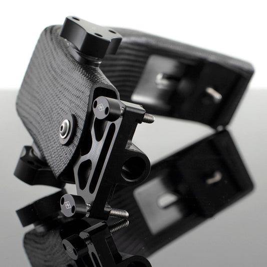 A black carbon arm for a camera stabilizer or similar equipment, showing a reflective metal surface